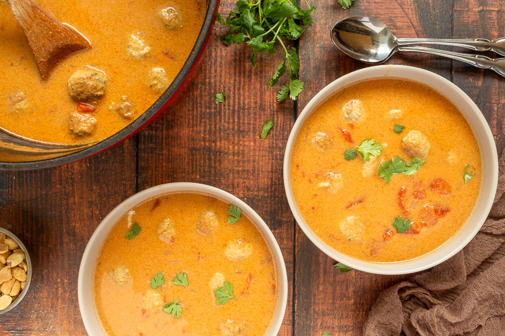 Overhead shot of peanut soup in bowls.