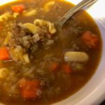 hamburger soup in bowl with spoon