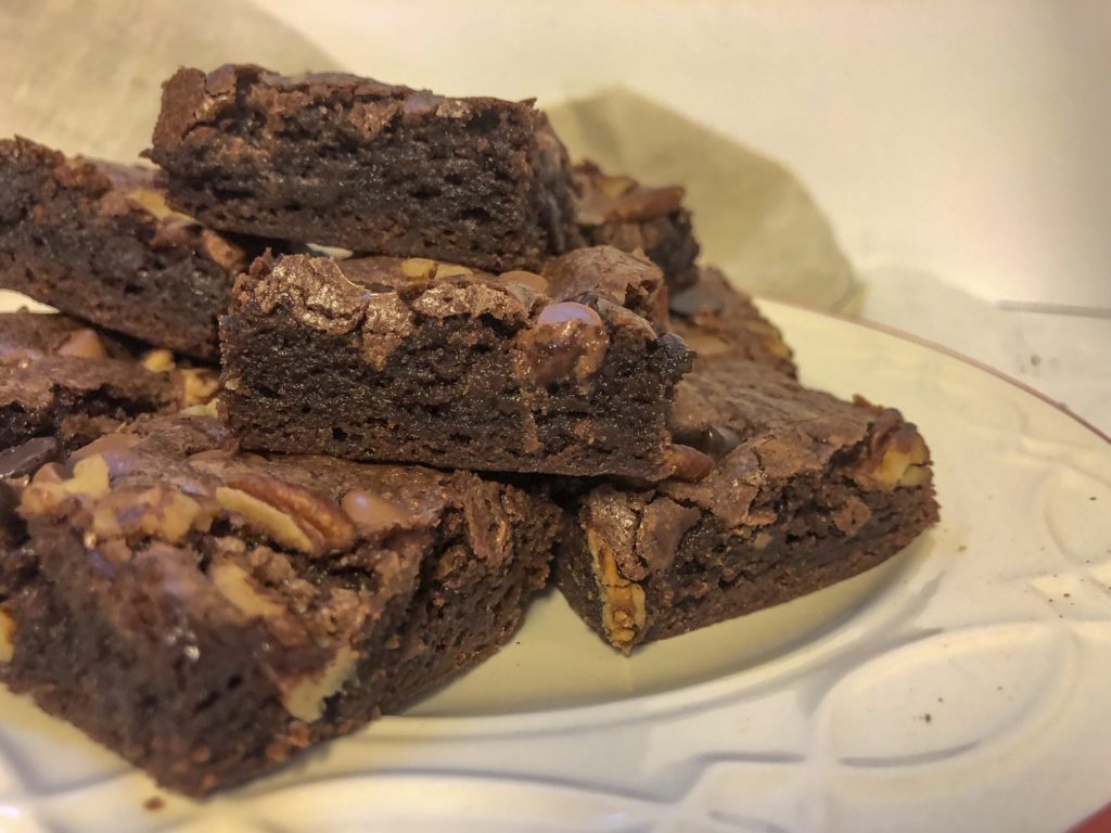 classic brownies stacked on plate