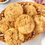 Overhead shot of Cinnamon raisin muffins with streusel in basket.