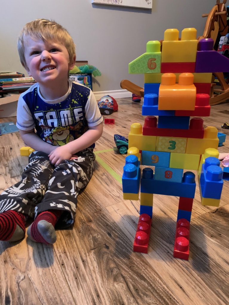 Playing mega bloks in Spring 2020.