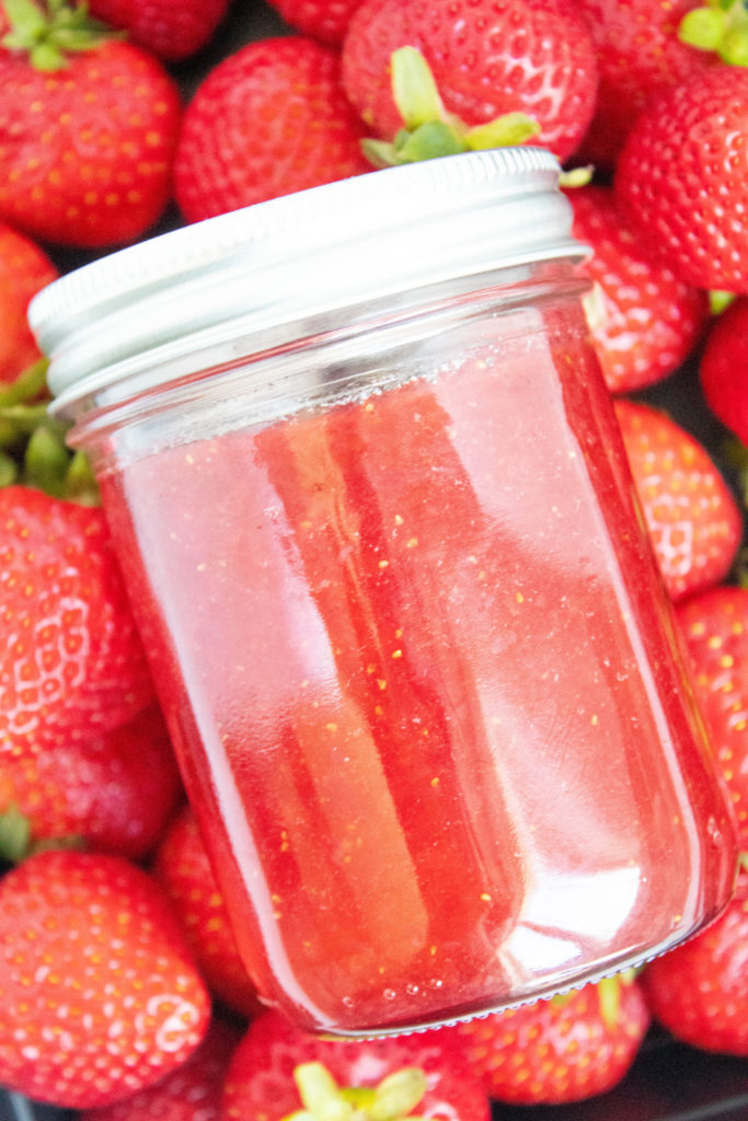 Strawberry Jam on top of fresh strawberries