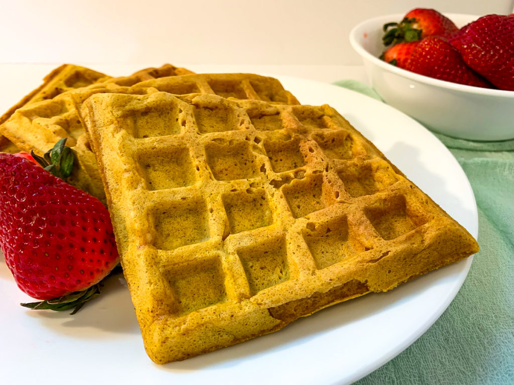 Pumpkin Spice waffles on plate with strawberries