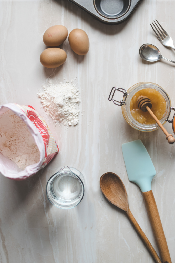 Wooden ladle and spatula on top of table