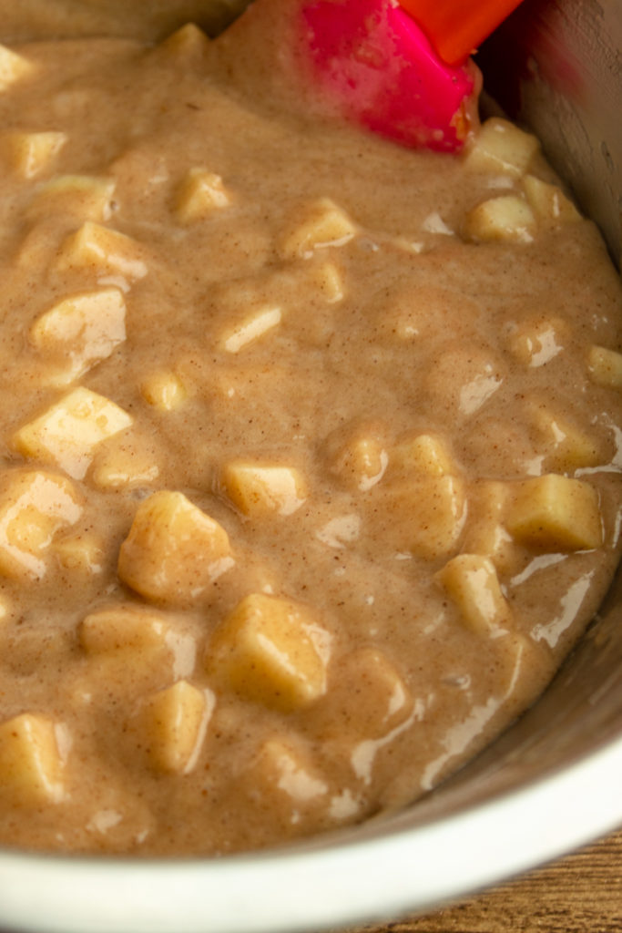 apple cinnamon muffin batter in bowl with spatula