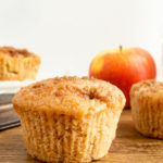 apple cinnamon muffins with apple in background