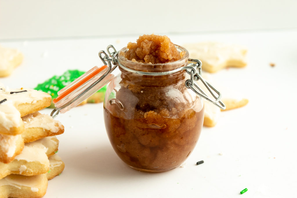 Sugar cookie body scrub in cute jar with sugar cookies surrounding