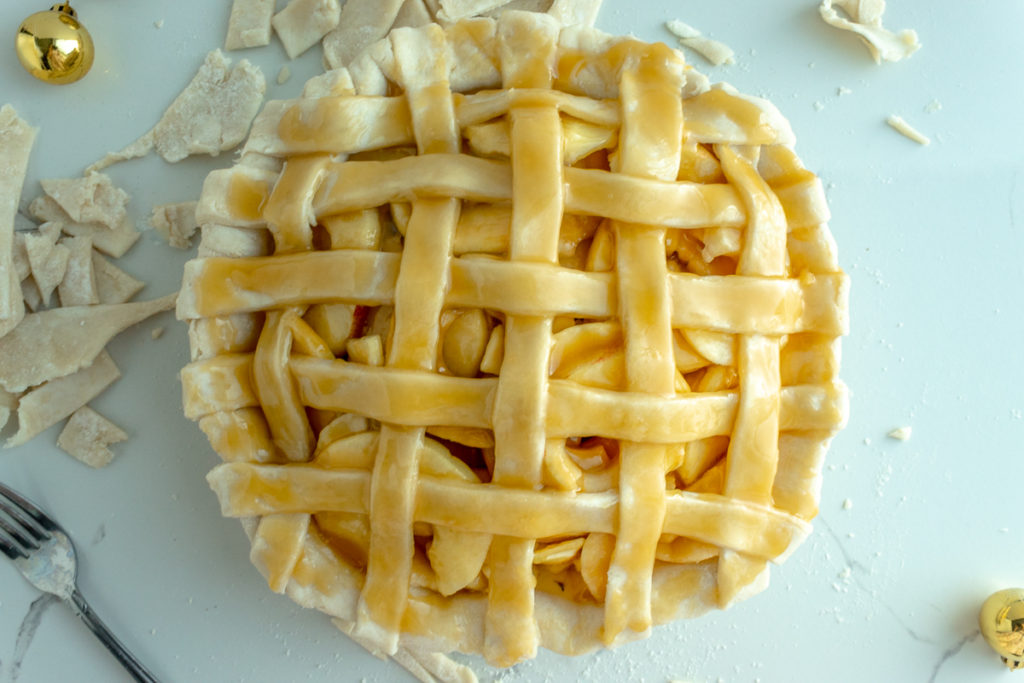 Overhead shot of unbaked lattice pie.