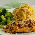 chicken parmesan on plate with spaghetti and broccoli