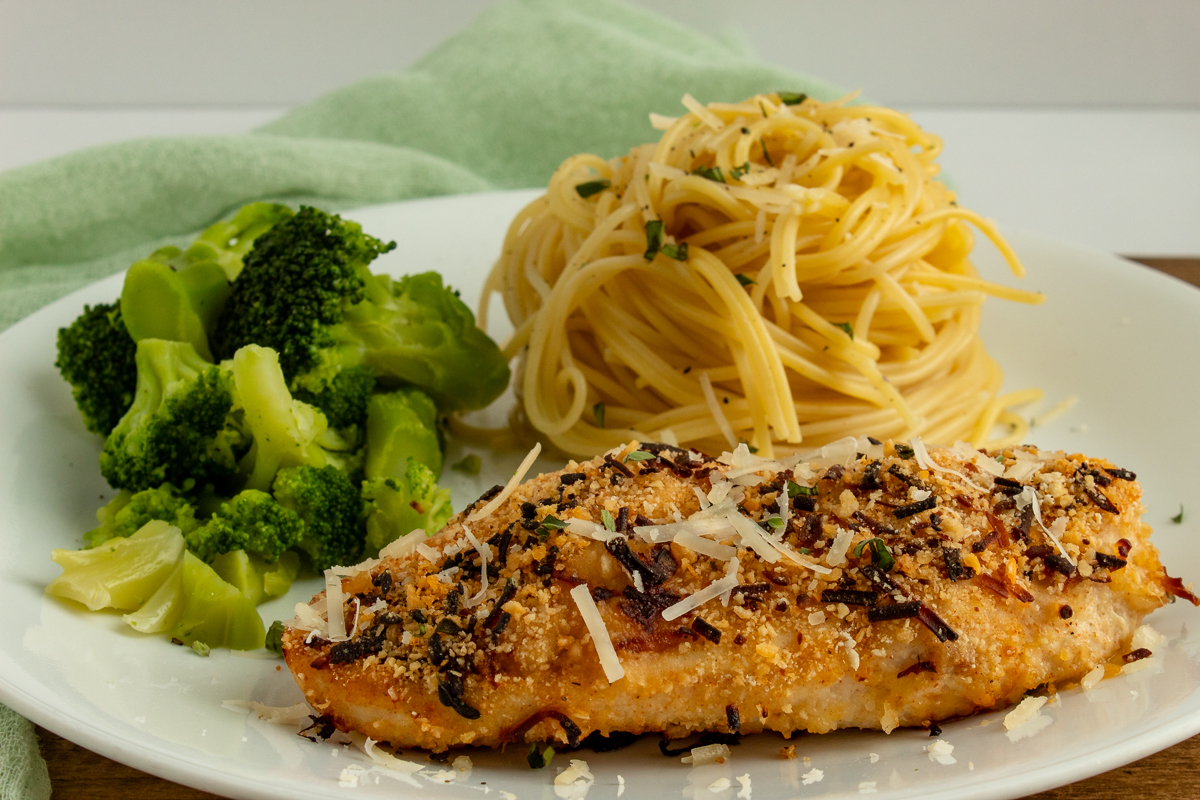 chicken parmesan on plate with spaghetti and broccoli