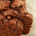 Double Chocolate Banana Bread on parchment paper on wire rack.