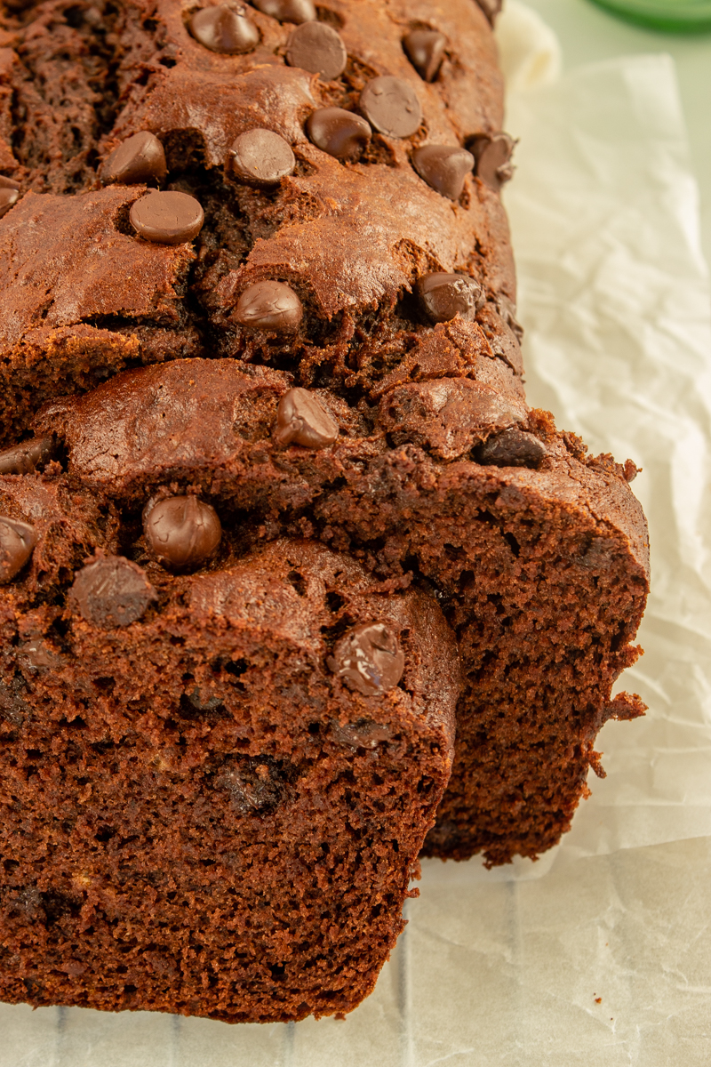 Double Chocolate Banana Bread on parchment paper on wire rack.