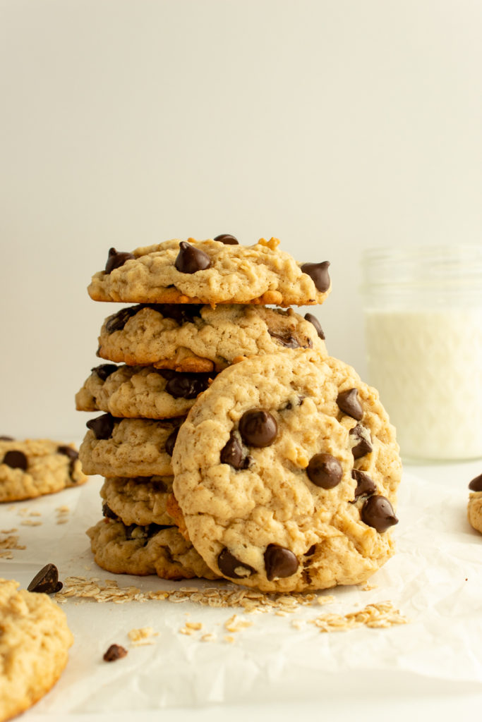 Oatmeal Chocolate Chip cookies stacked with a cookie in front straight shot.