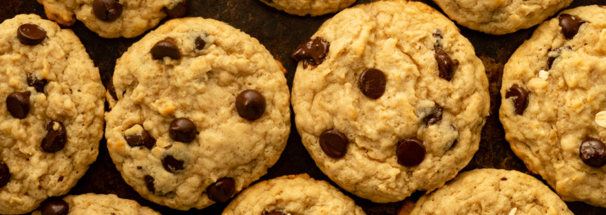 Oatmeal Chocolate Chip cookies overhead shot on cookie sheet.