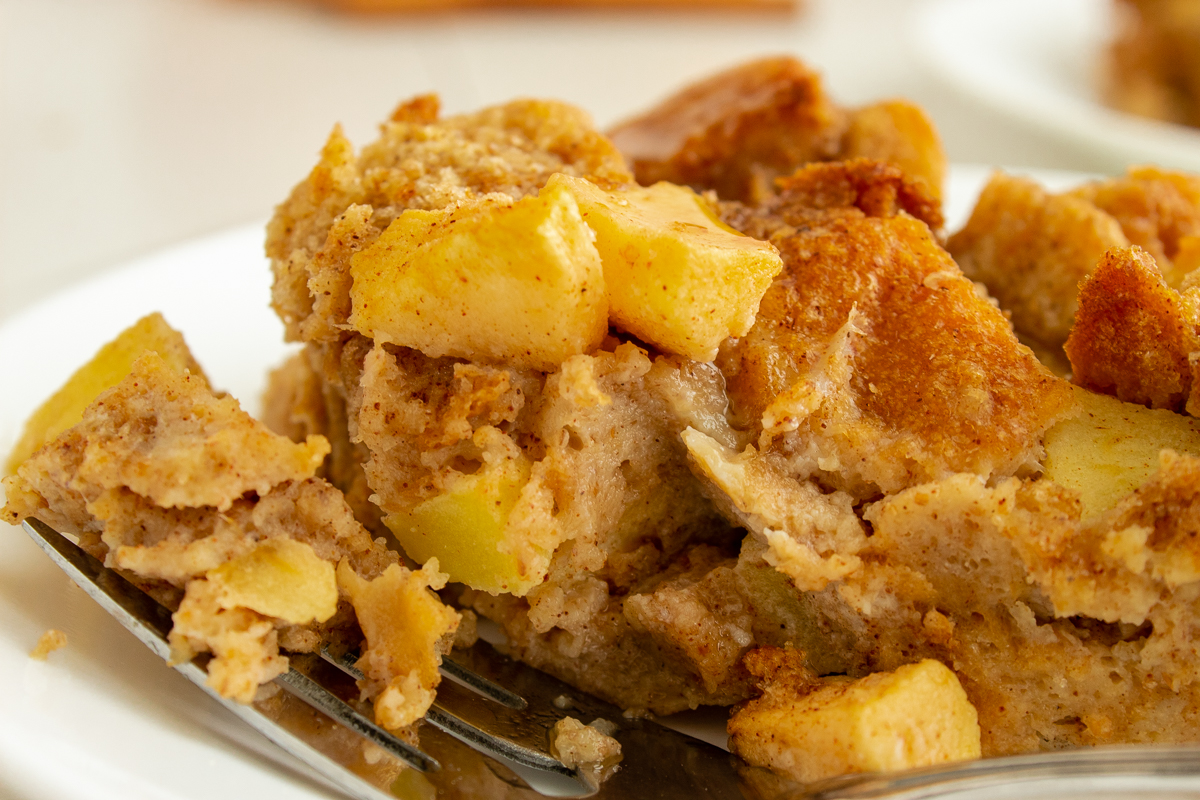 Apple Cinnamon French toast casserole on plate with fork close up