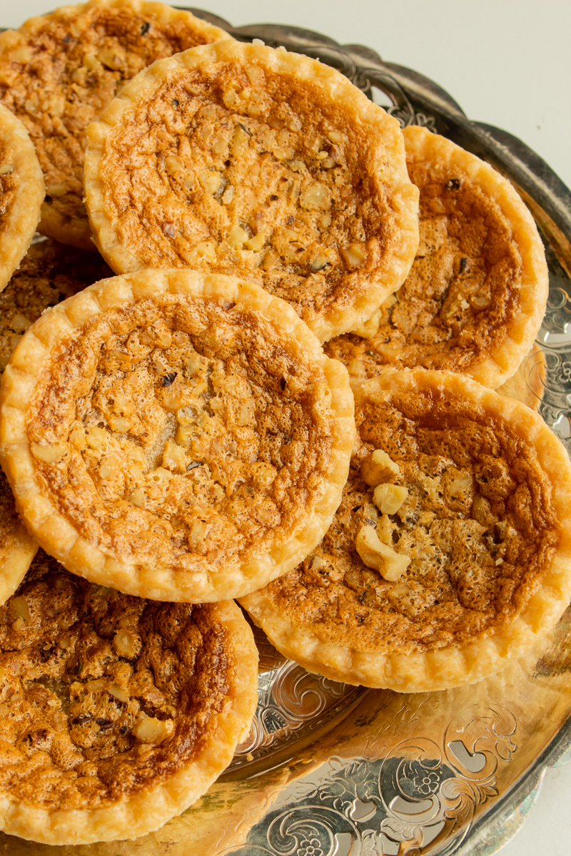 Super Easy Butter Tarts on vintage metal plate.