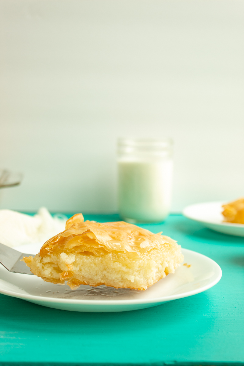 Galactoboureko side shot being served on plate.