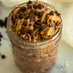 Chocolate Peanut butter overnight oats in mason jar angled shot.