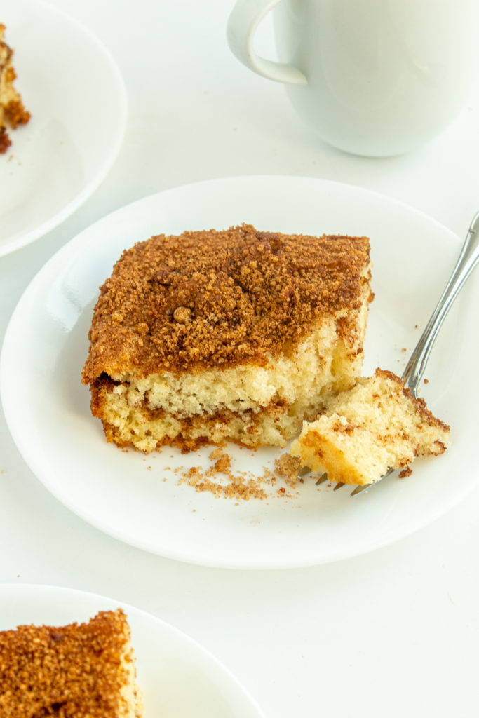 Moist Coffee Cake on plate with fork angled shot.