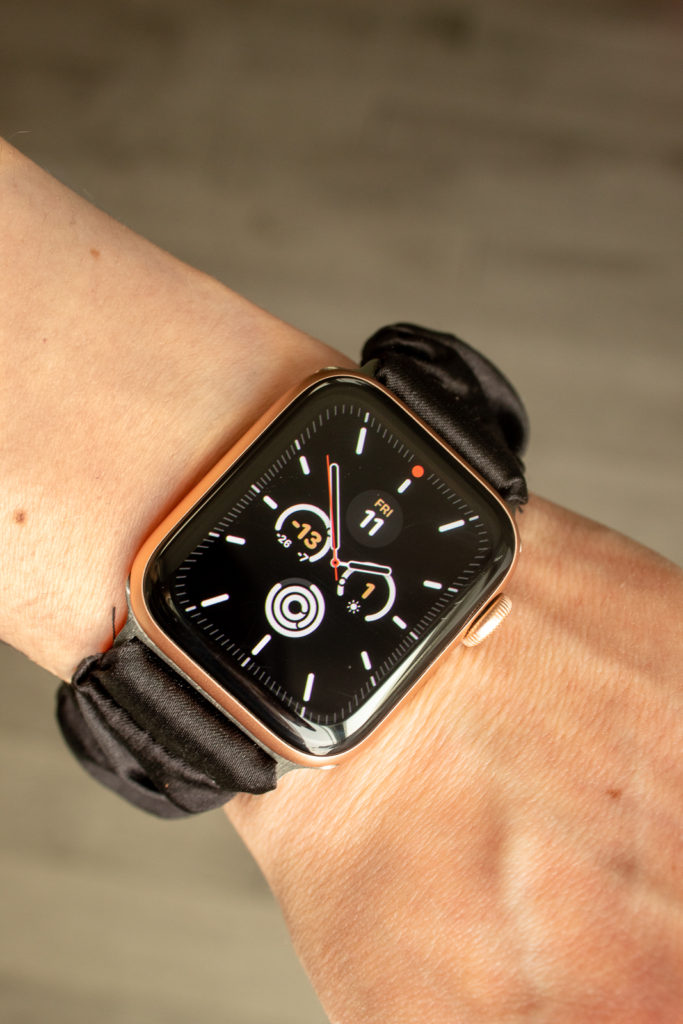 Apple Watch with black silk Scrunchie band.