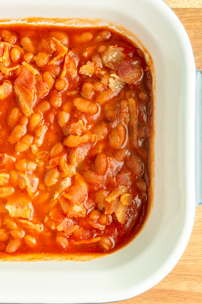 Overhead shot of baked beans in casserole dish.