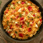 Fried rice overhead shot in frying pan on dark brown surface