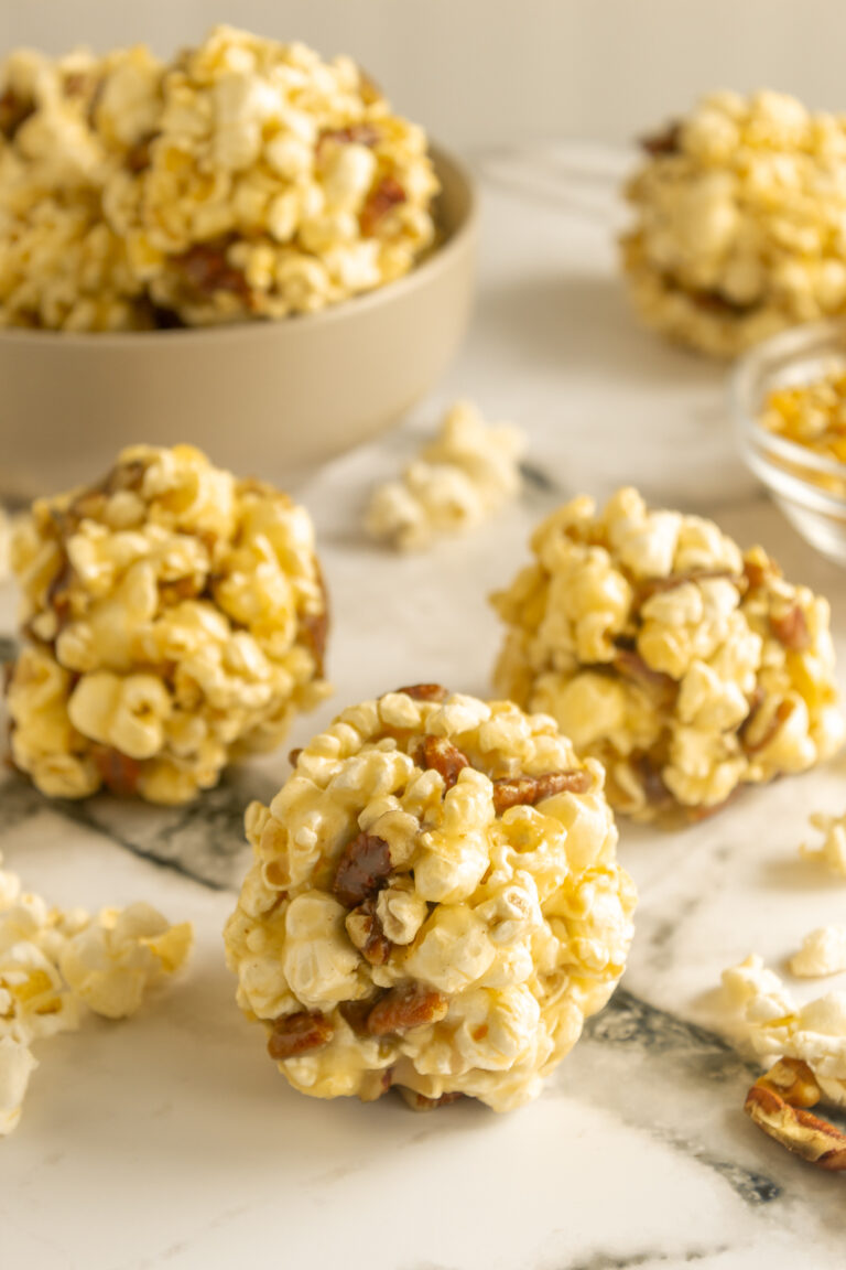 Popcorn balls old fashioned on marble surface angled shot.