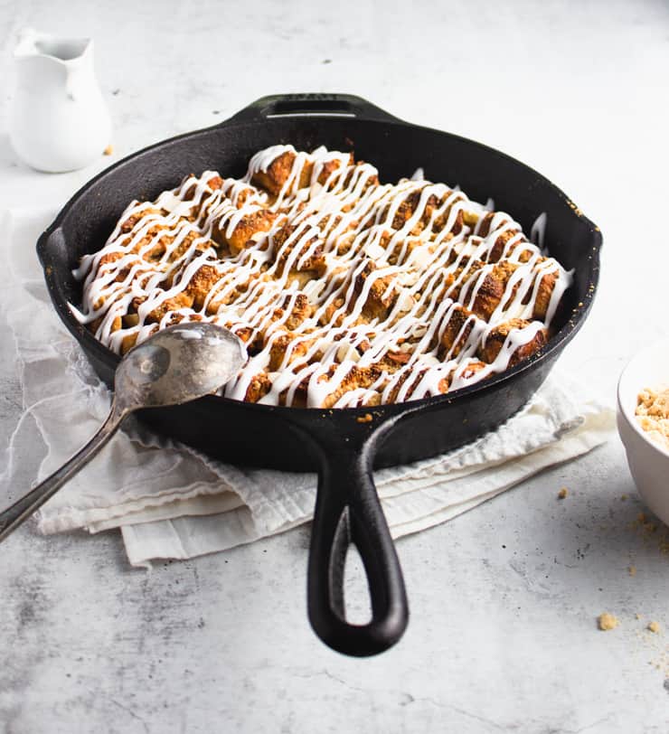 Angled shot of french toast casserole in cast iron pan.