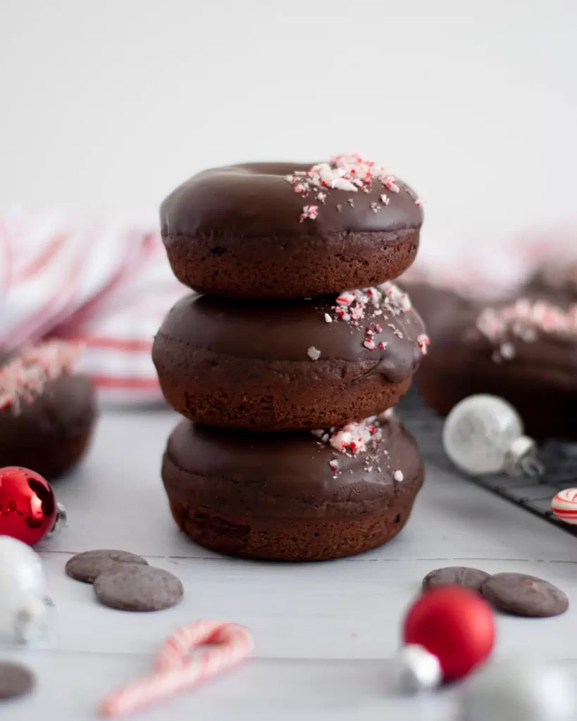 Peppermint mocha donuts stacked on top of eachother.