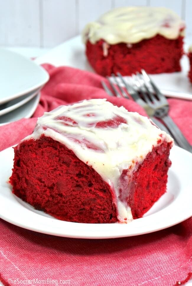 Red velvet cinnamon rolls on plate.