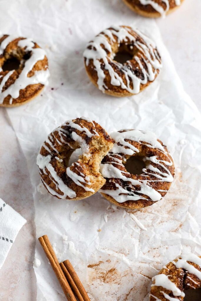 Cinnamon rolls donuts on parchment paper.