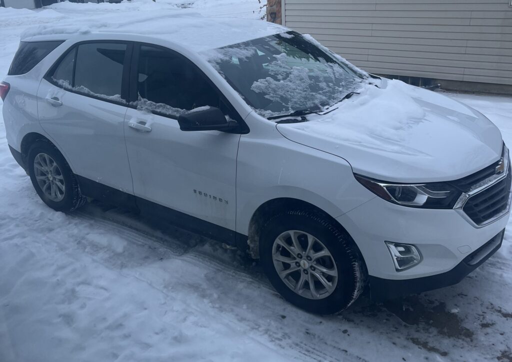 Chevrolet Equinox sitting in driveway.