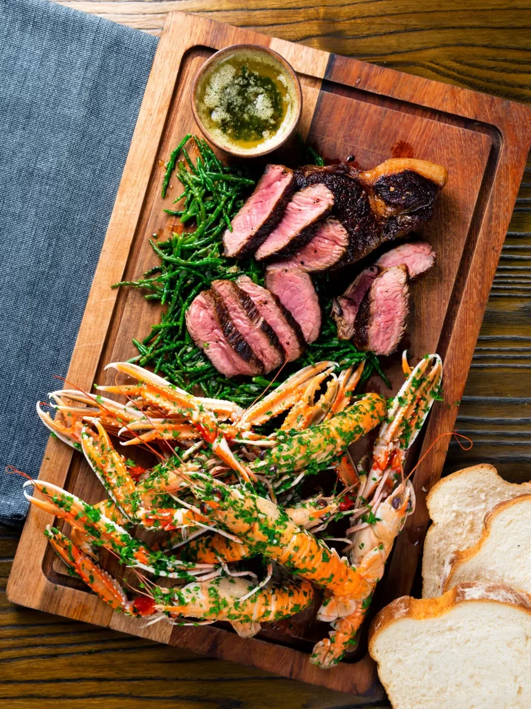 Romantic dinner recipe for two: overhead shot of surf and turf.