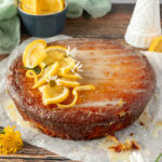 Easy healthy orange cake on parchment paper angled shot.