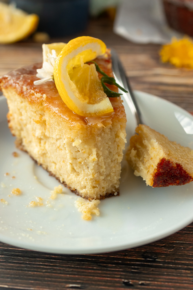 Angled close up of a slice of orange cake.