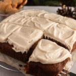 Angled shot of Gingerbread cake being served.