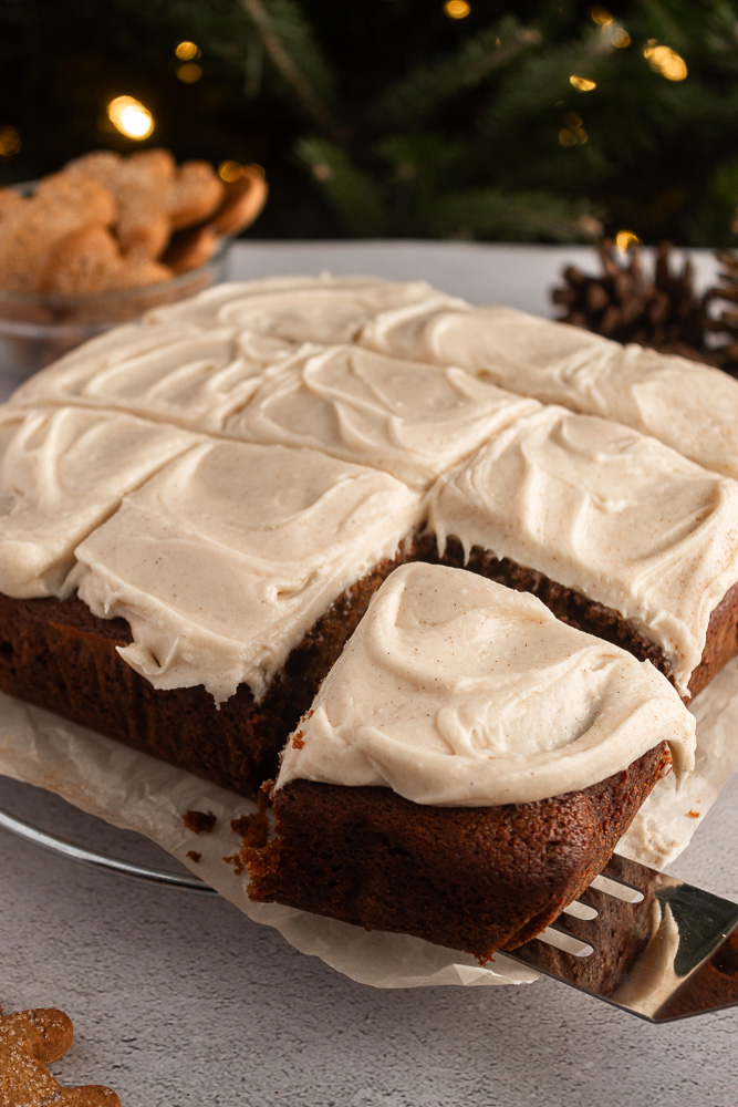 Angled shot of Gingerbread cake being served.