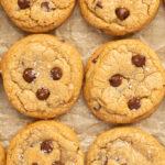 Overhead shot of Brown Butter chocolate chip cookies lined up on parchment paper.